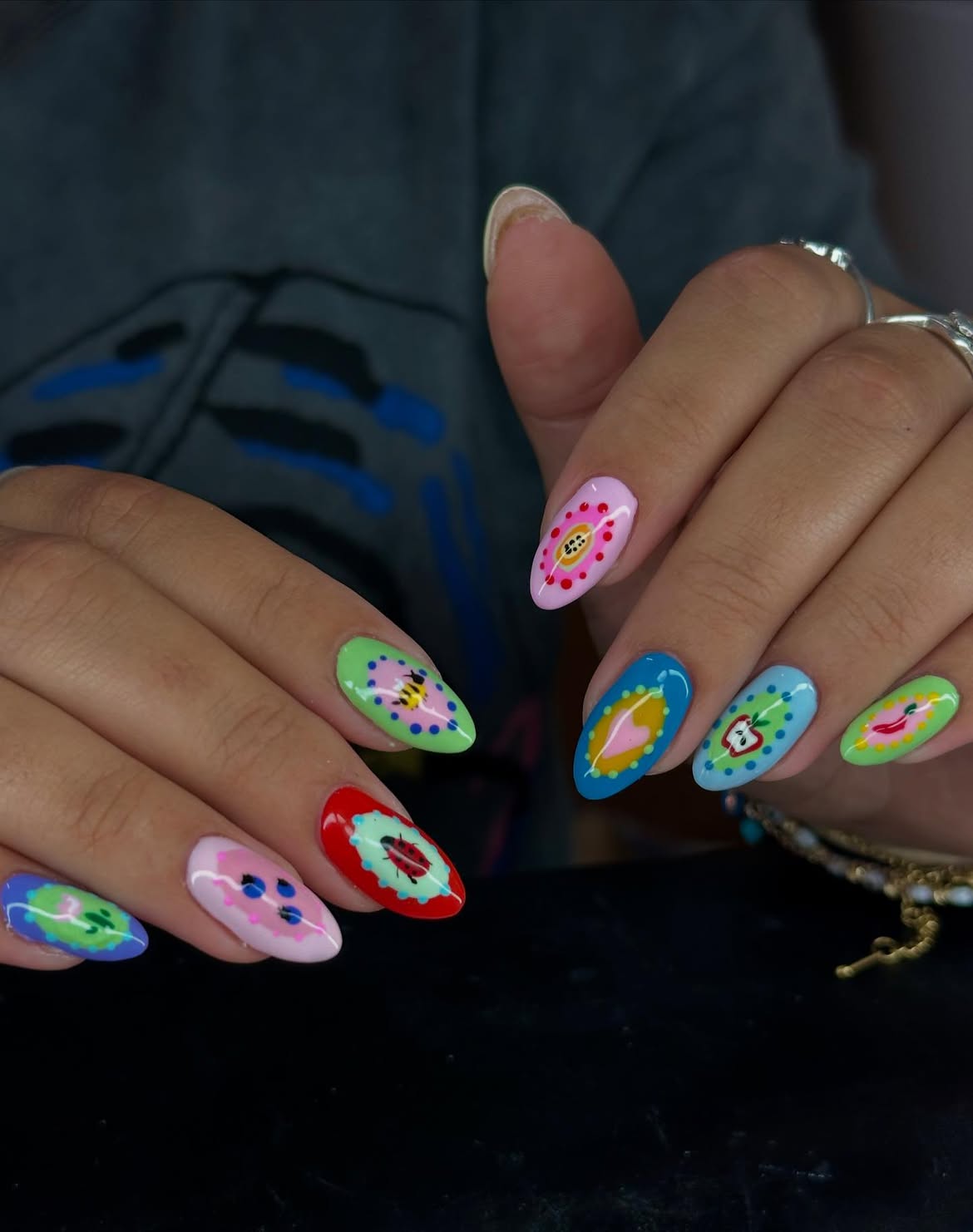 Whimsical Retro Fruit and Ladybug Nail Art