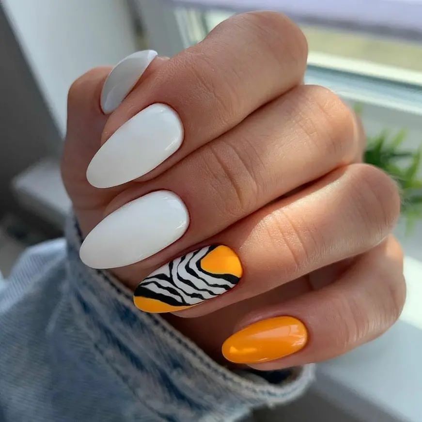Zebra Print Orange Almond Nails
