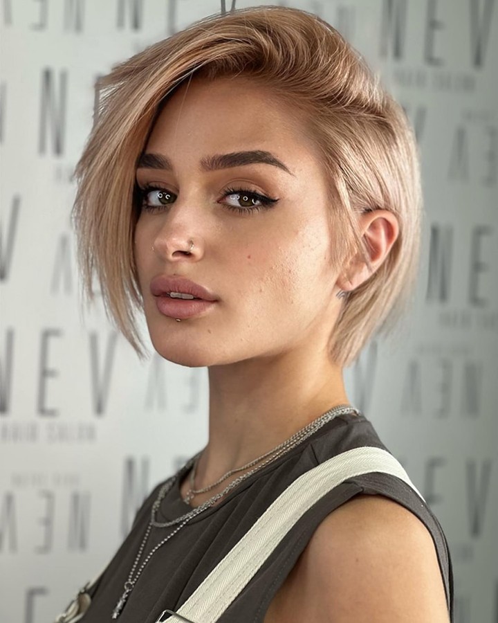 Asymmetrical Blonde Pixie Bob With Subtle Layers
