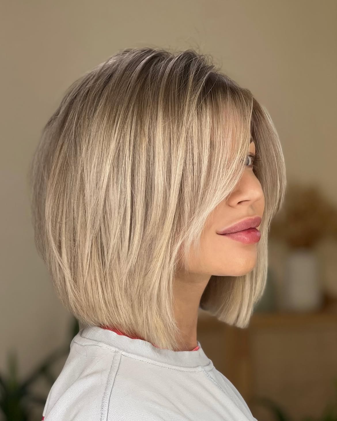 Blonde Layered Bob With Face Framing Bangs