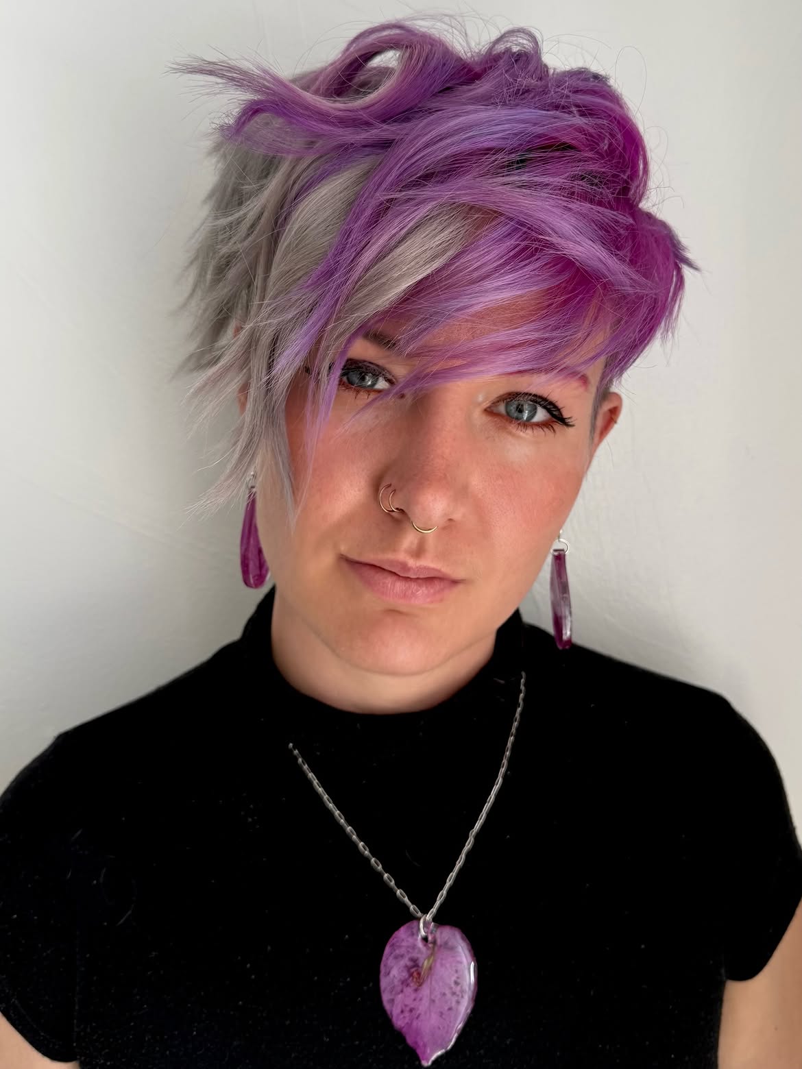 Bold Purple Streaks On Asymmetrical Pixie