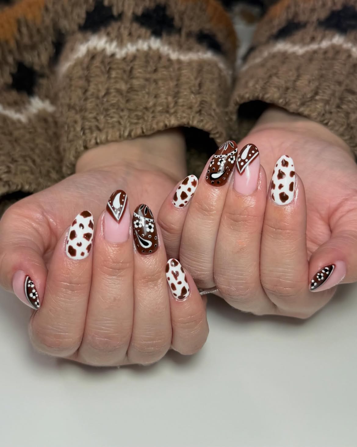 Brown and White Cow Print Almond Nails