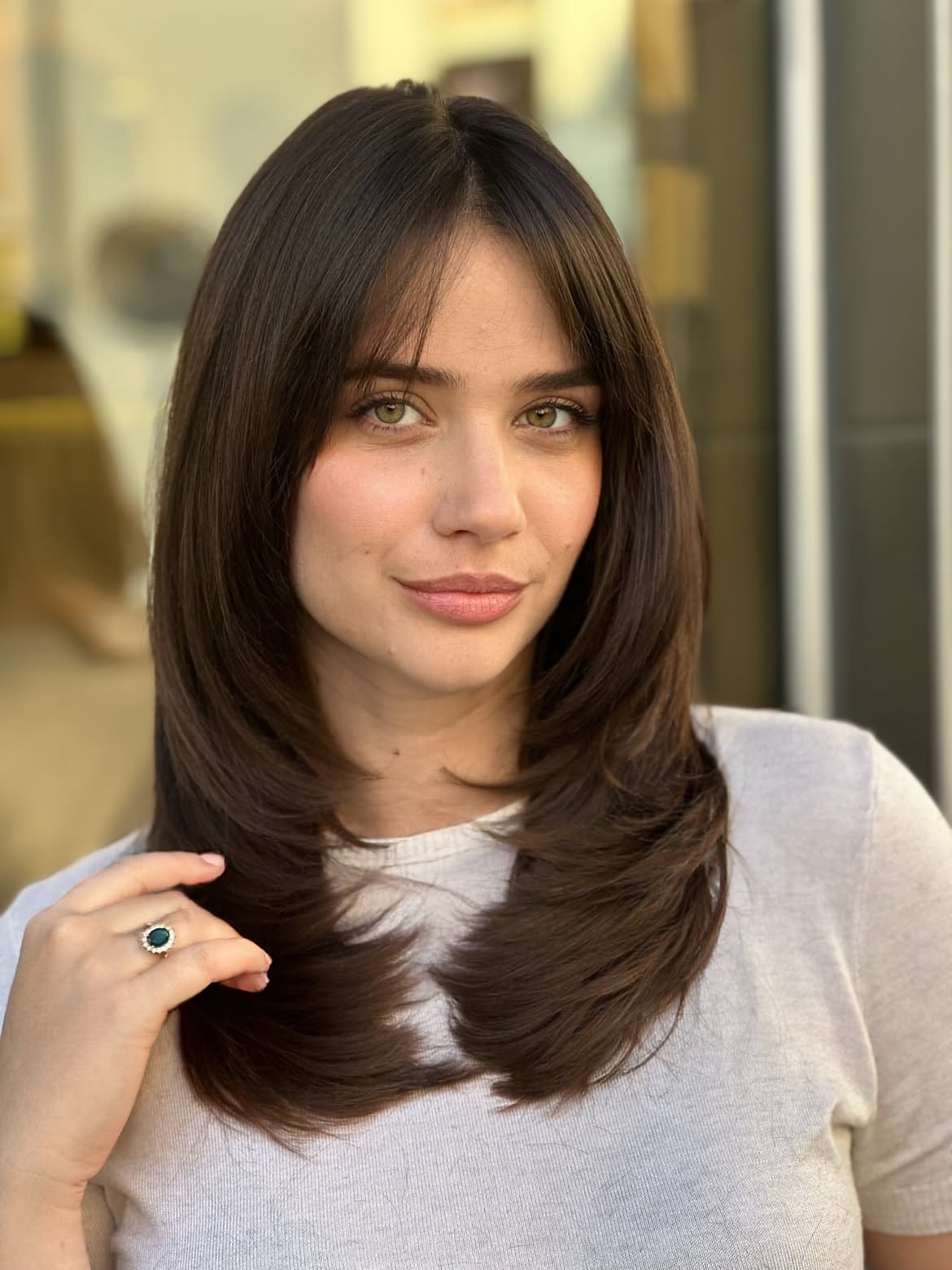 Chic Layered Collarbone Cut With Face-Framing Bangs