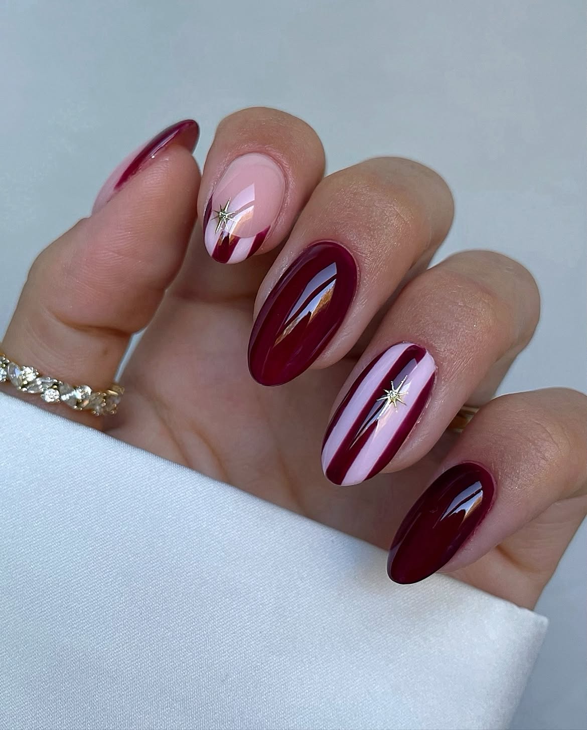 Deep Berry French Tips With Gold Star Accent