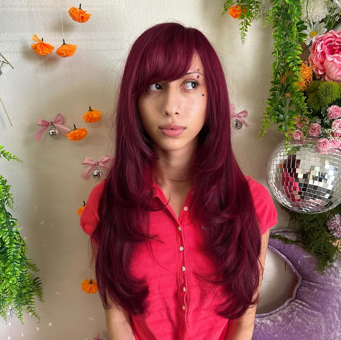 Deep Magenta Layers With Side Swept Bangs