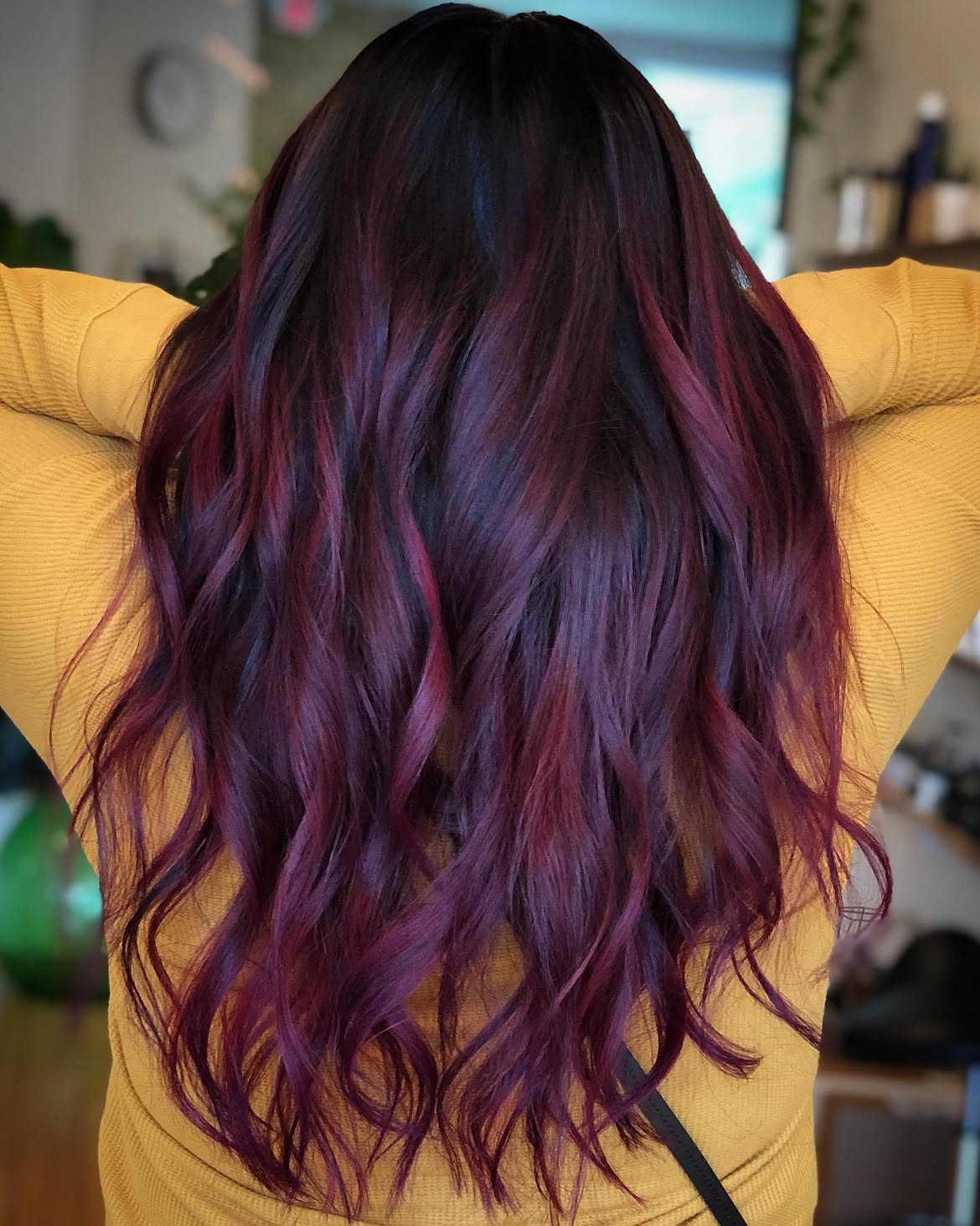 Deep Plum Balayage On Long Layered Waves