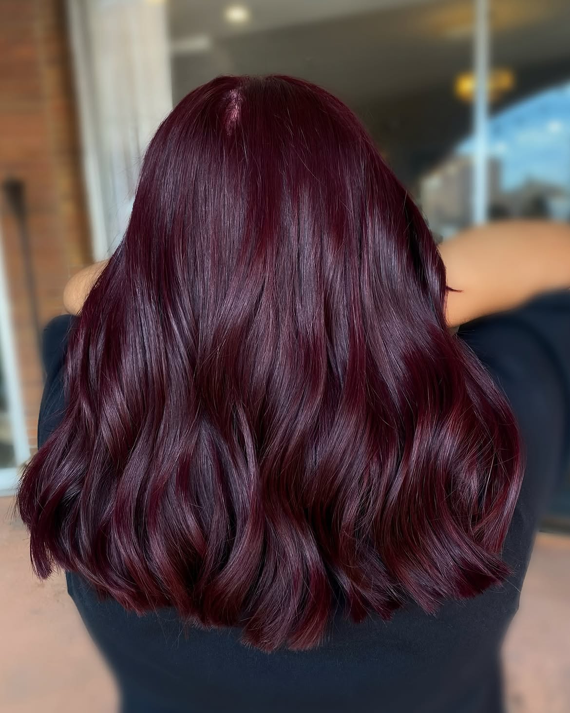 Deep Plum Glossy Waves On Mid Back Length Hair