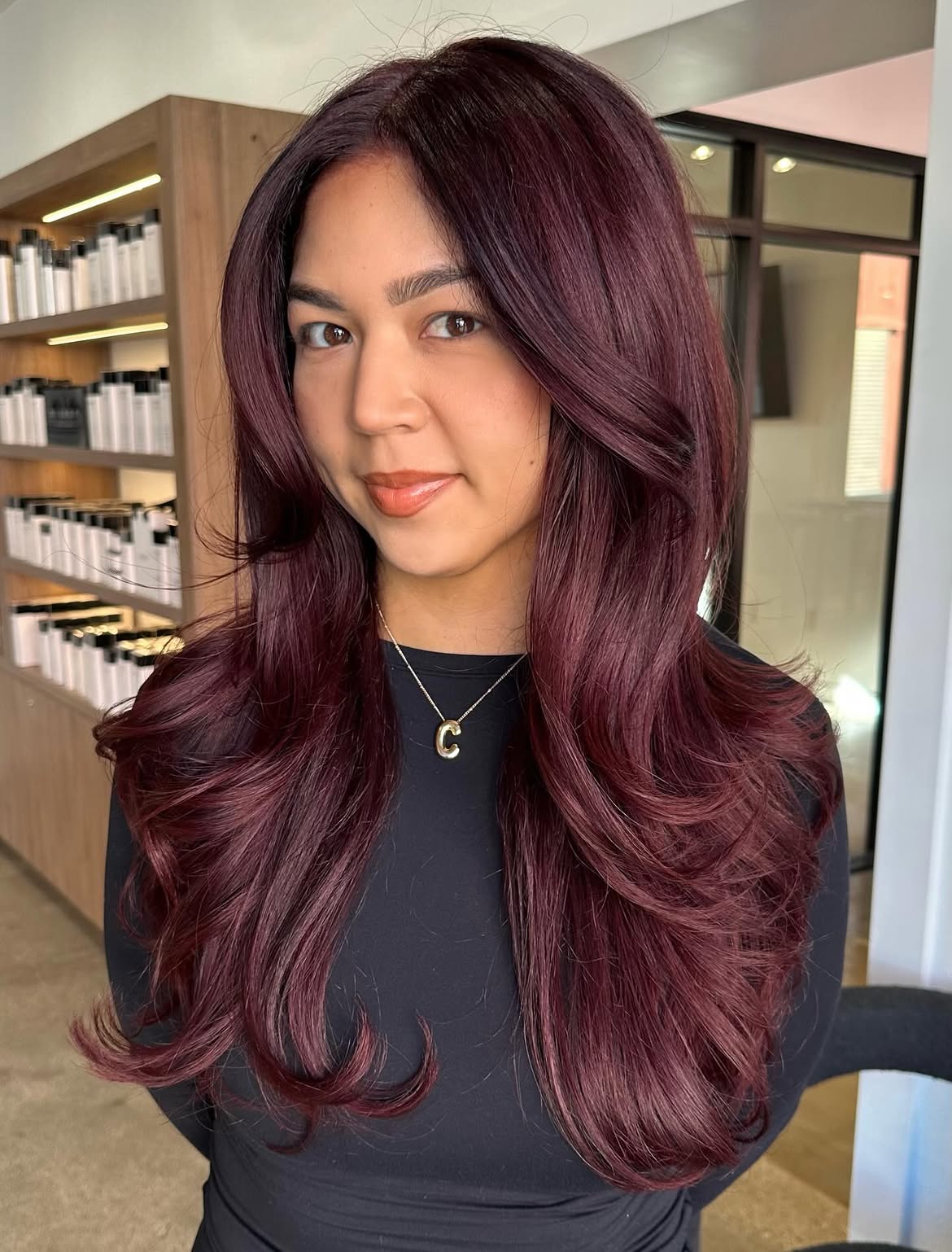Deep Plum Layers With Voluminous Face Framing