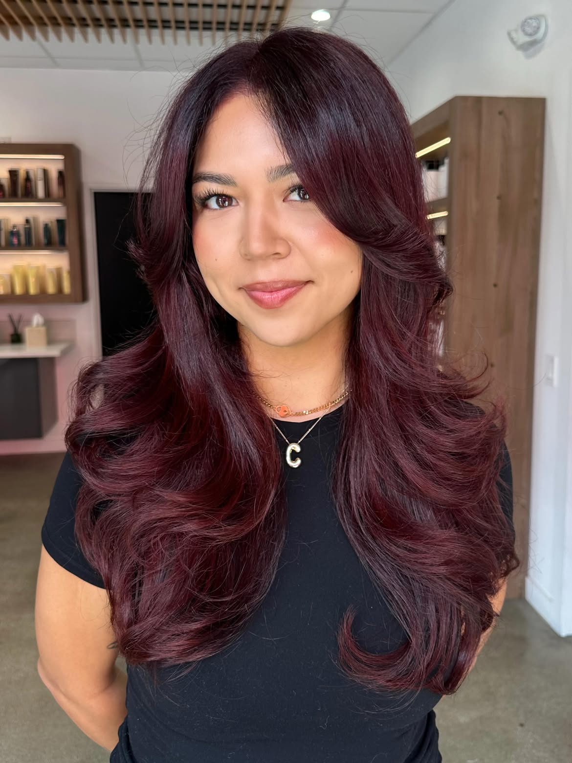 Deep Plum Layers With Voluminous Face Framing