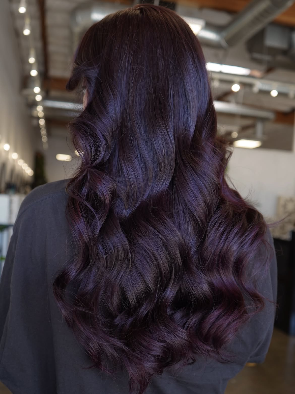 Deep Plum Waves On Long Layered Hair