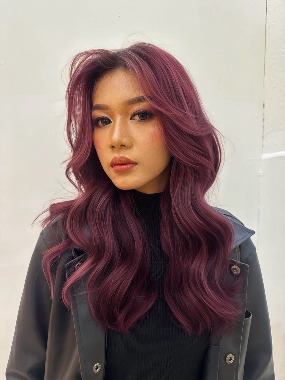 Deep Plum Waves With Voluminous Face Framing Layers
