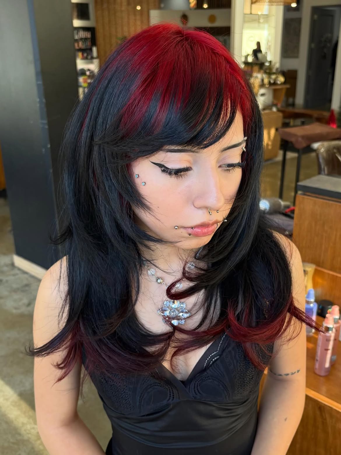 Edgy Layered Wolf Cut With Cherry Red Highlights