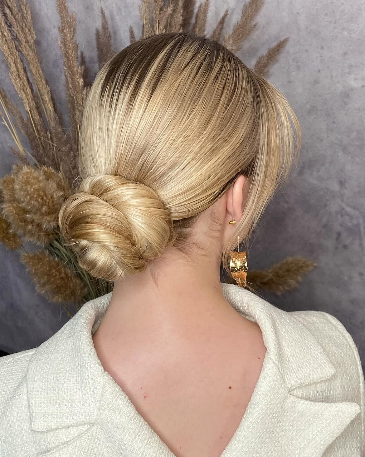 Elegant Low Twisted Chignon With Blonde Highlights