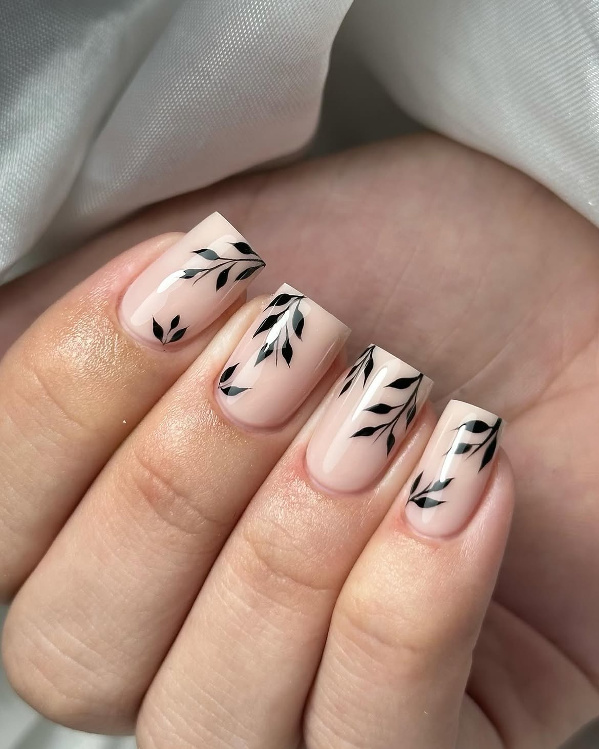 Elegant Nude Leaf Swirl Nail Art