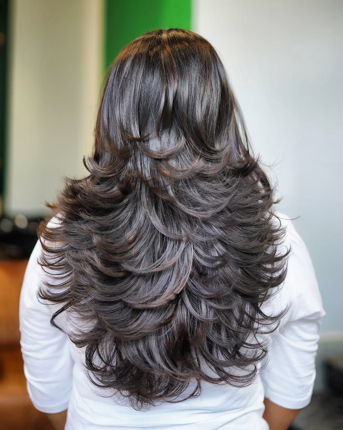 Feathered Layers With Voluminous Curls