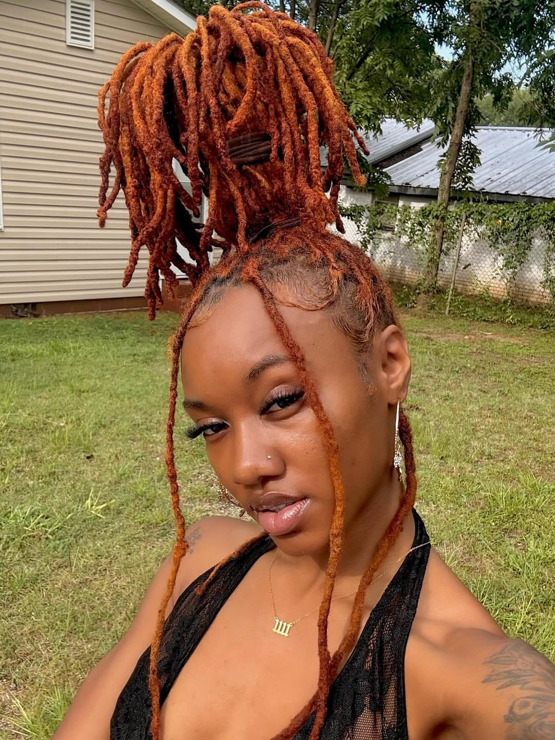 Fiery Copper Locs In A High Bun
