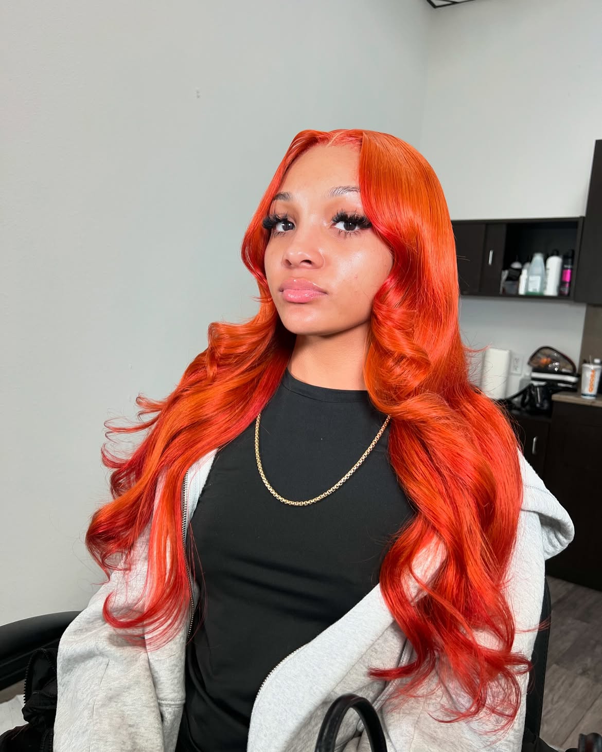 Fiery Orange Waves With Face-Framing Layers