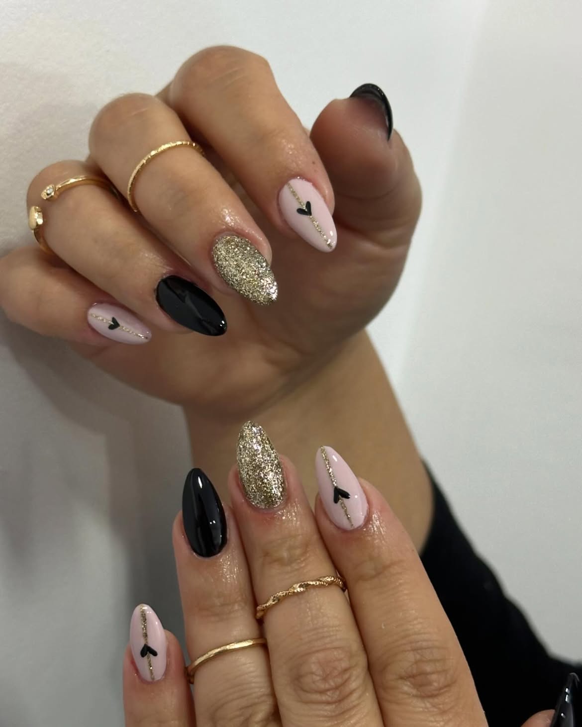 Glam Black and Pink Almond Nails with Gold Glitter