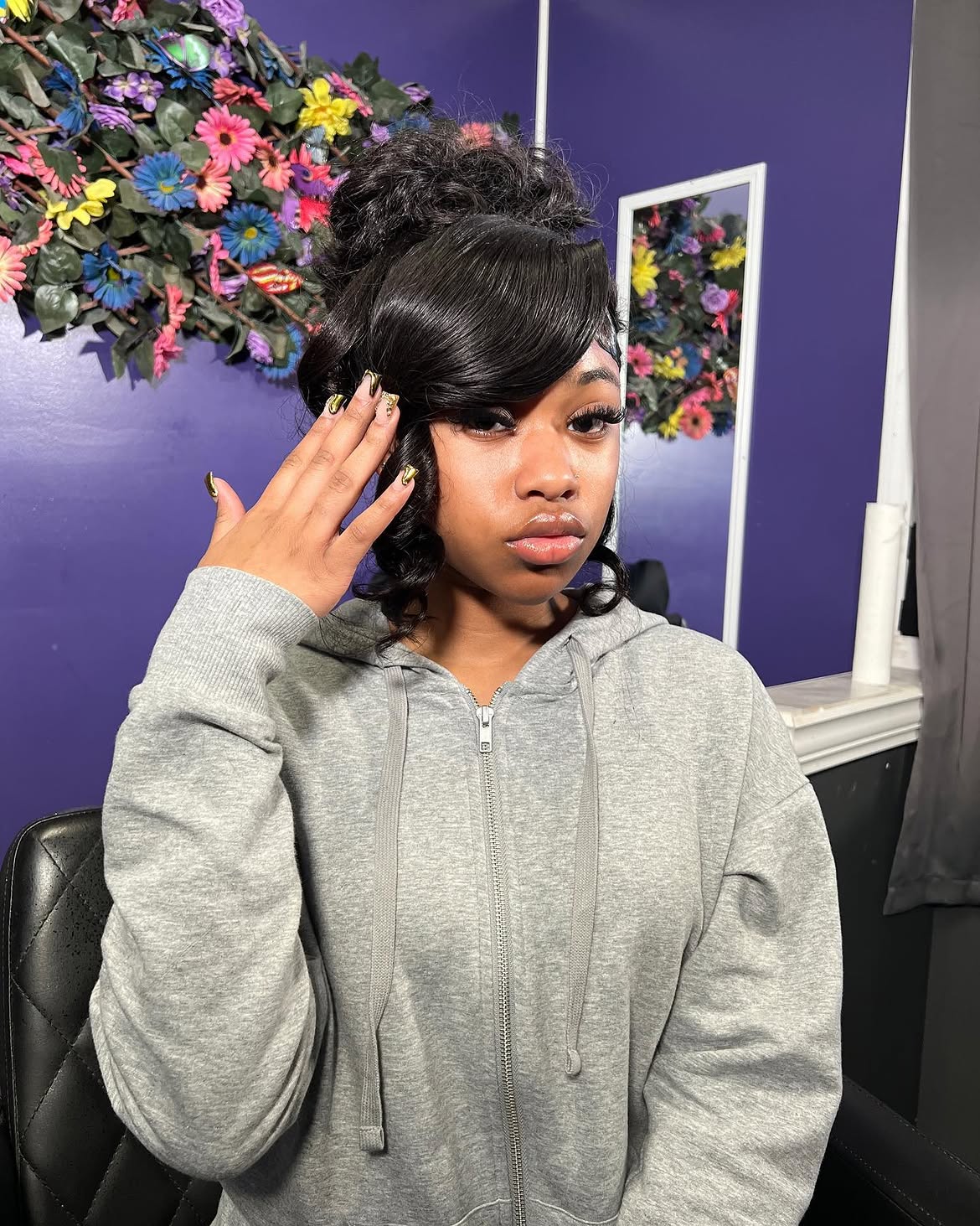 Glamorous High Bun With Side Sweep Bangs