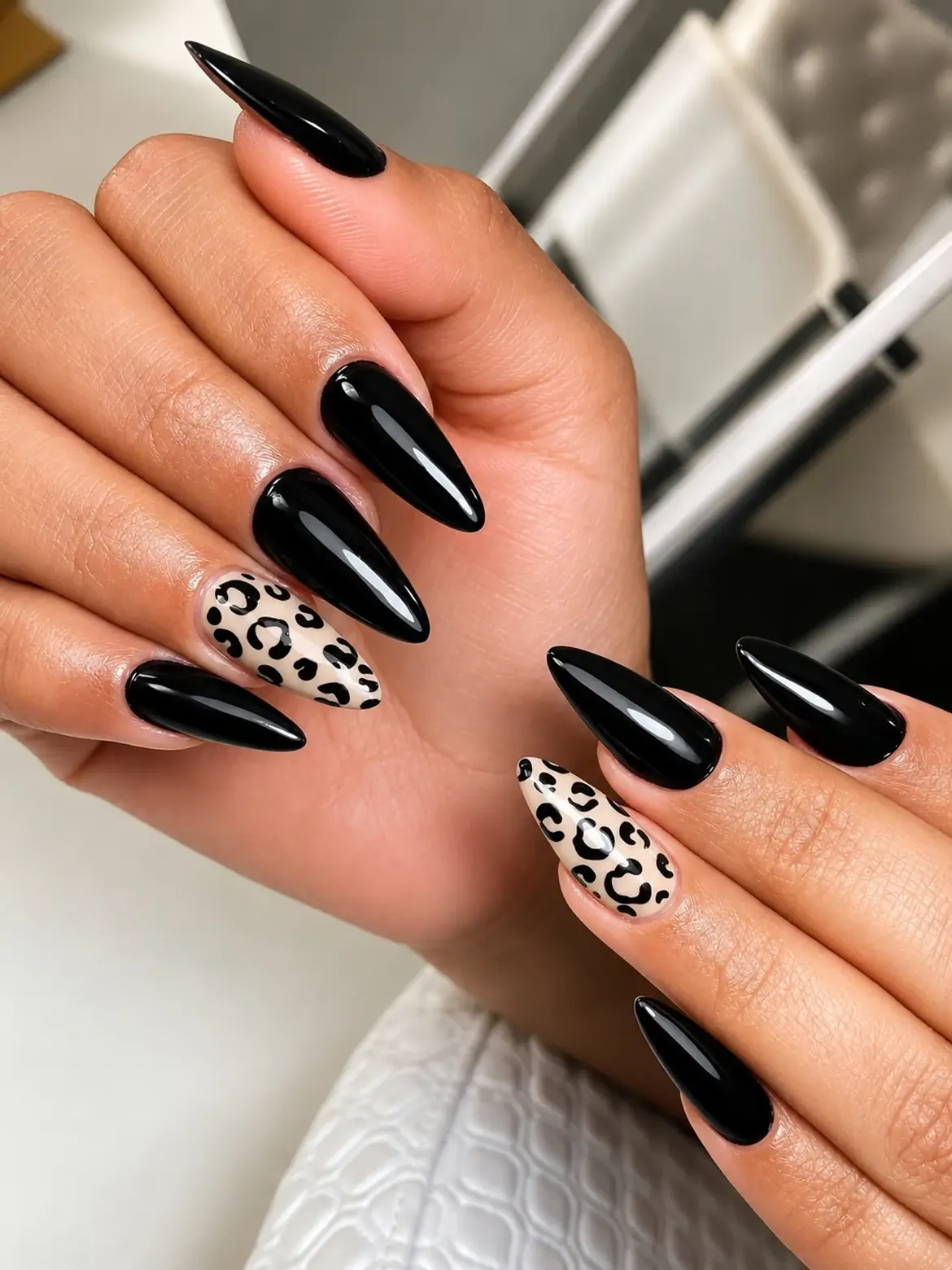 Glossy Black Stiletto Nails with Leopard Accent