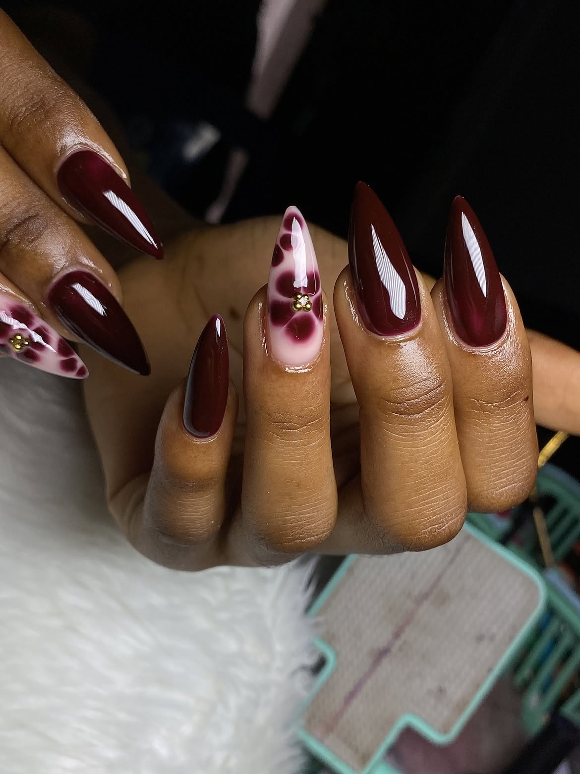 Glossy Deep Burgundy Marble Stiletto Nails