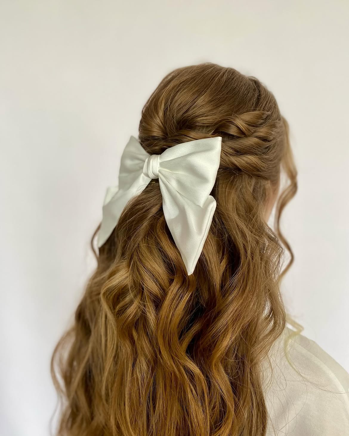 Half-Up Braids With Silky White Bow Accent