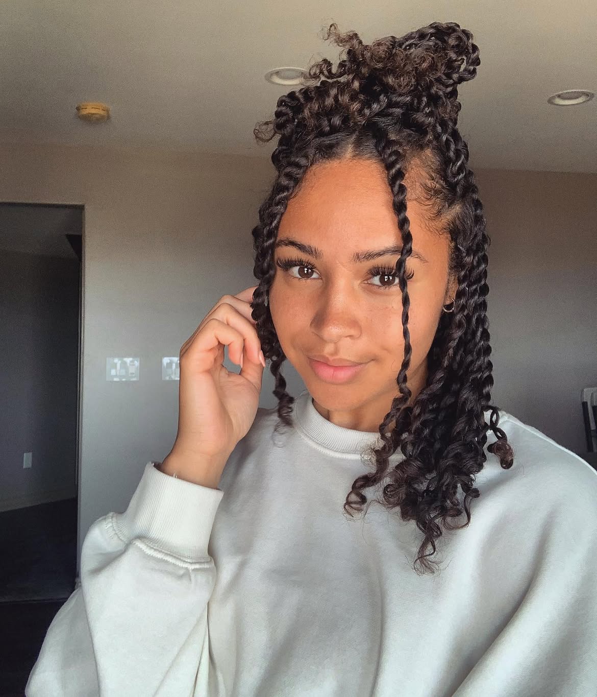 Half-Up Space Bun With Defined Twist Locs