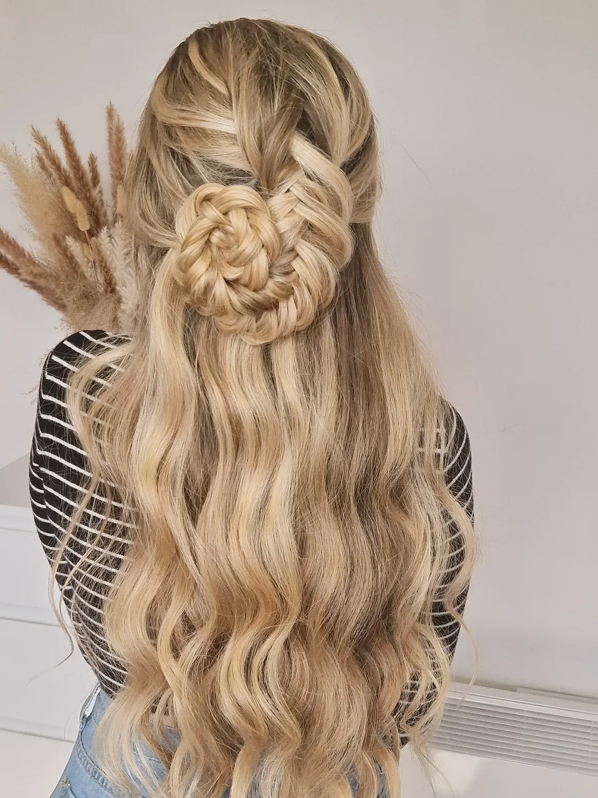 Intricate Braided Flower Bun With Loose Waves