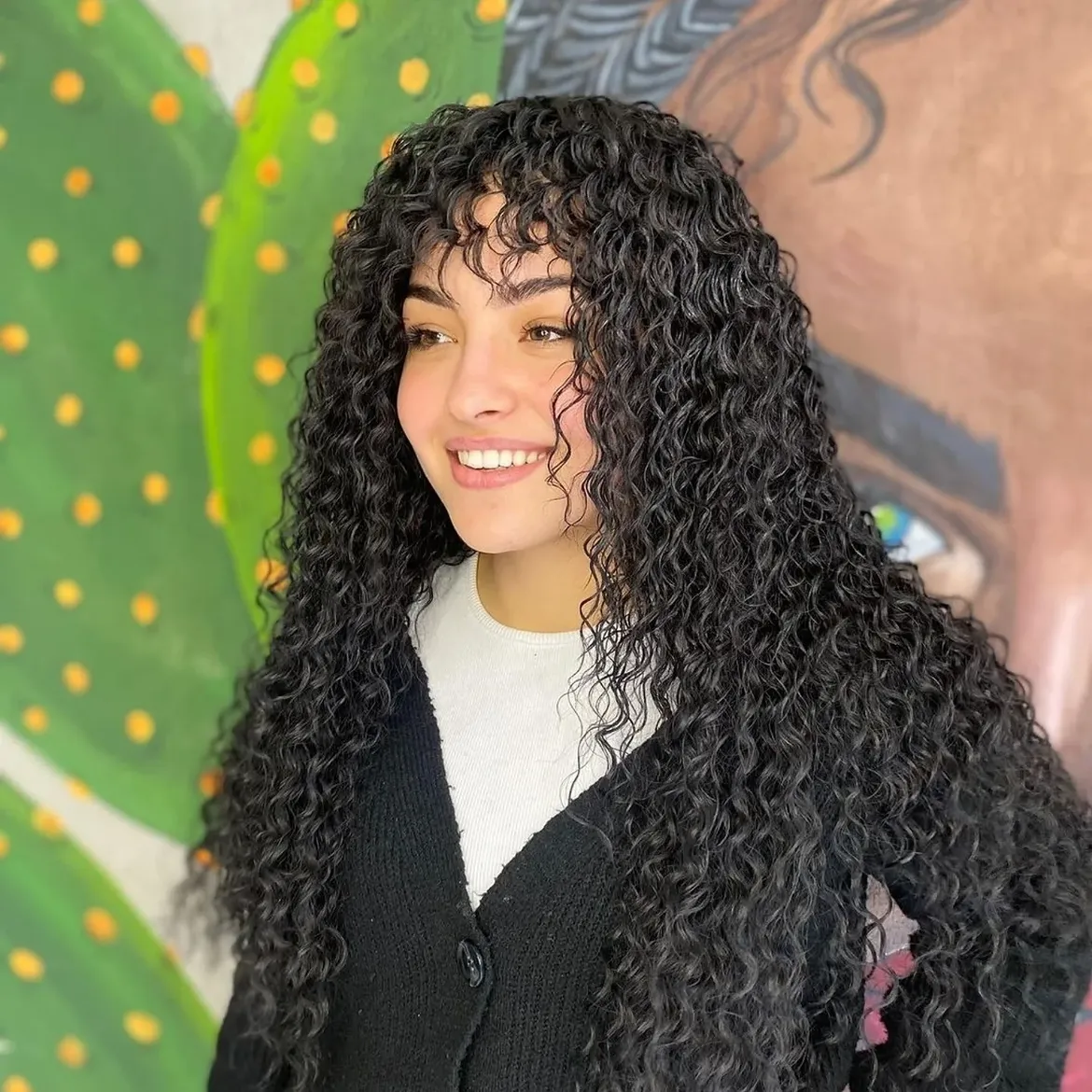 Long Curly Layers With Wispy Face Framing Fringe
