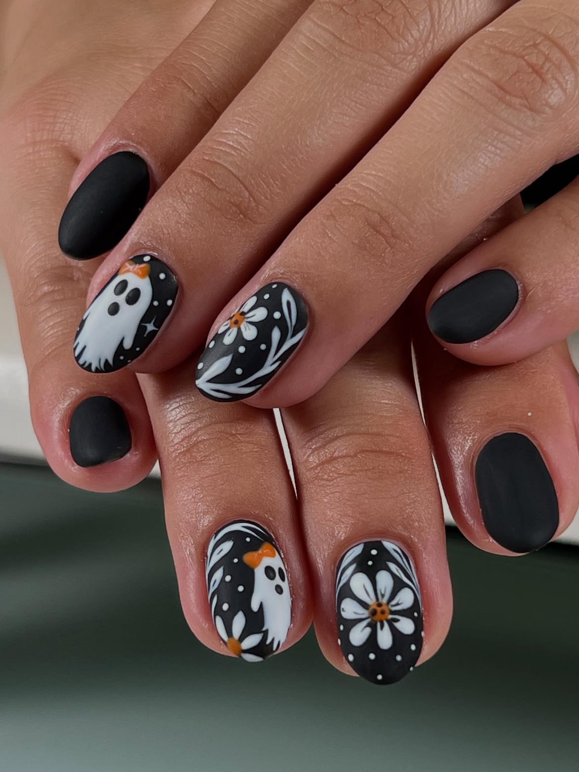 Matte Black Ghost and Daisy Oval Nails