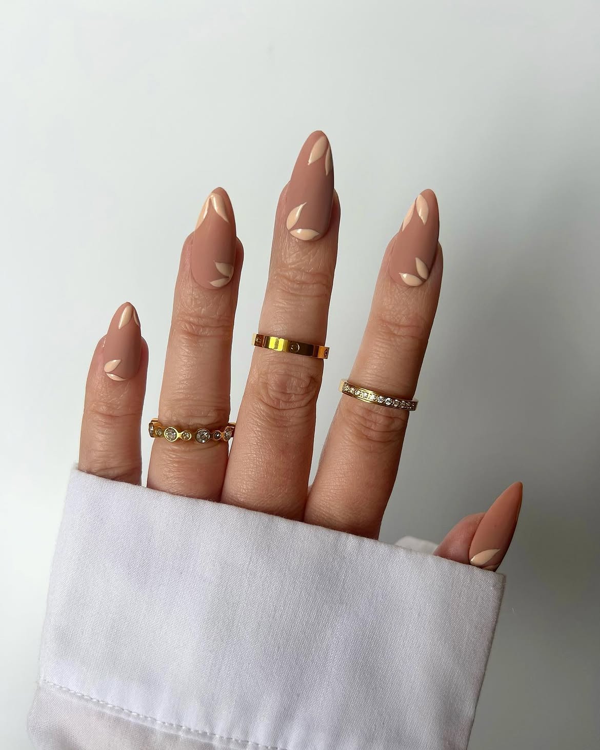 Matte Nude Almond Nails with Leaf Art