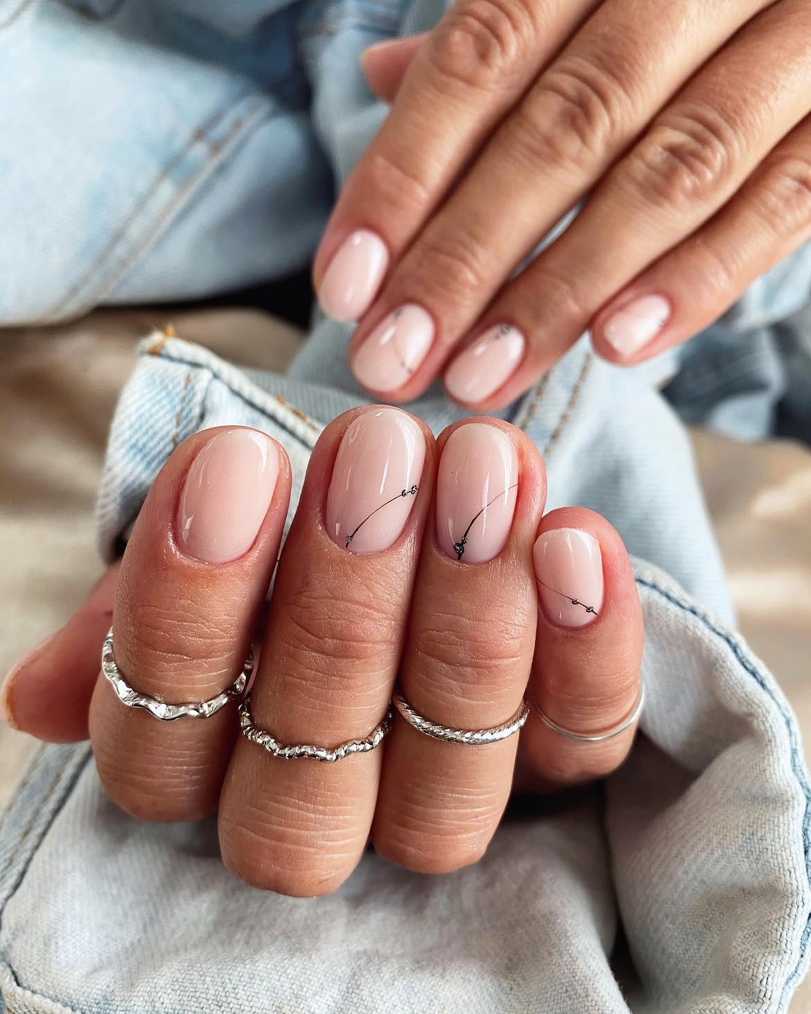 Milky Nude Oval Nails with Delicate Black Line Art