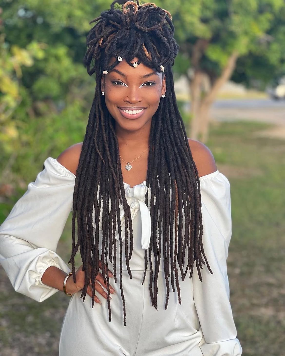 Ocean Pearl Dreadlock Updo With Loose Strands