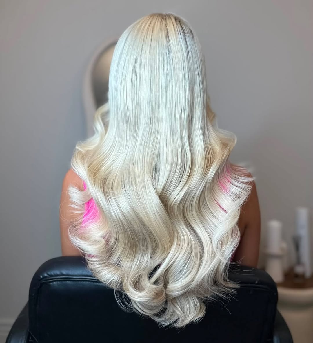 Platinum Blonde Beach Waves With Subtle Pink Highlights