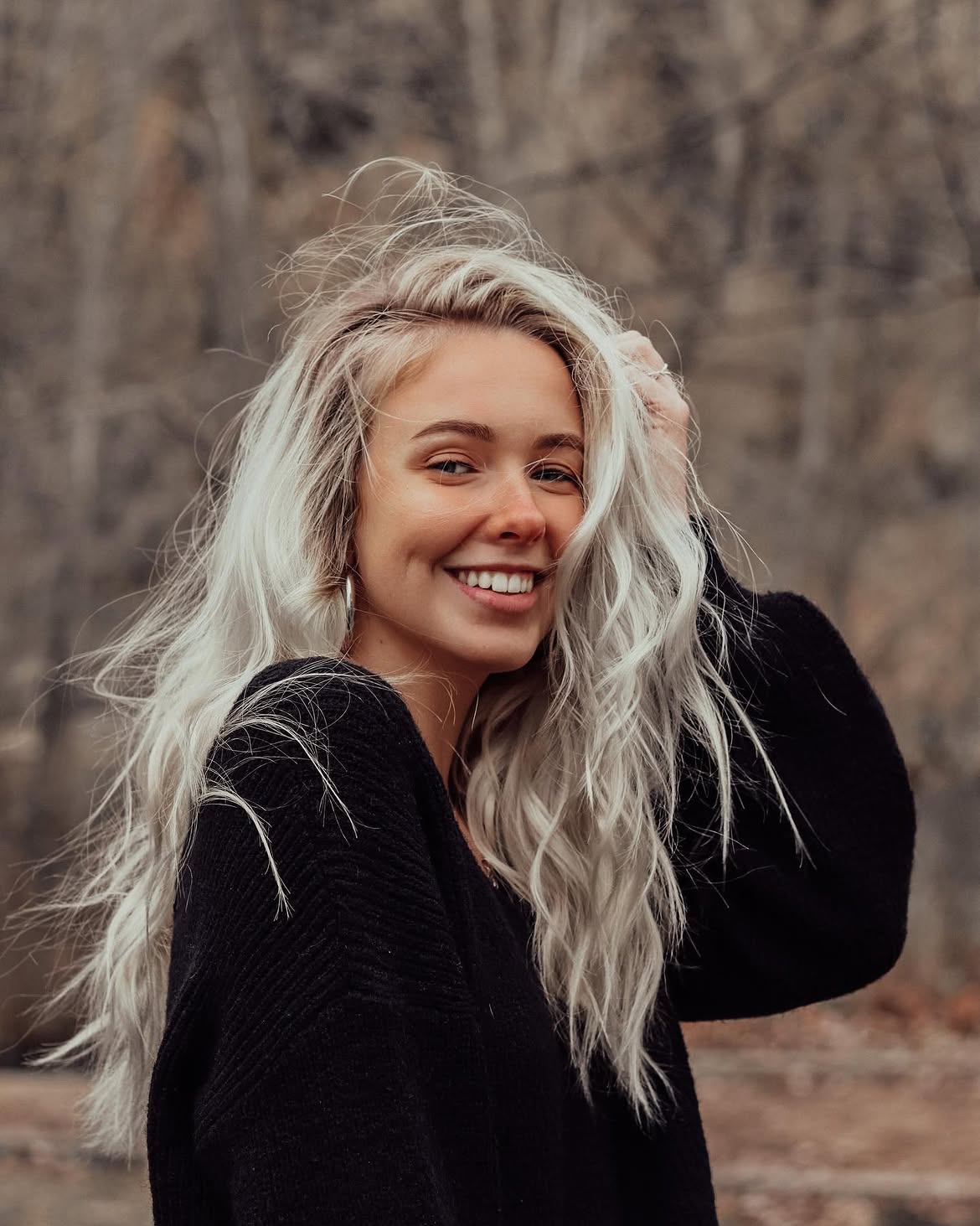 Platinum Blonde Beach Waves With Subtle Roots
