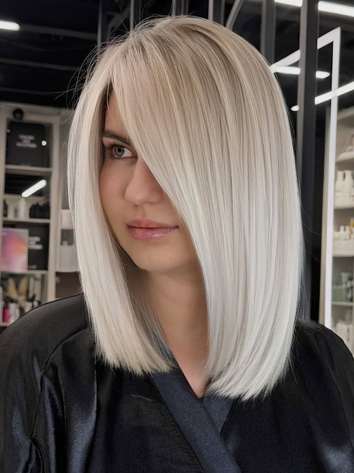 Platinum Blonde Collarbone Cut With Face Framing Bangs