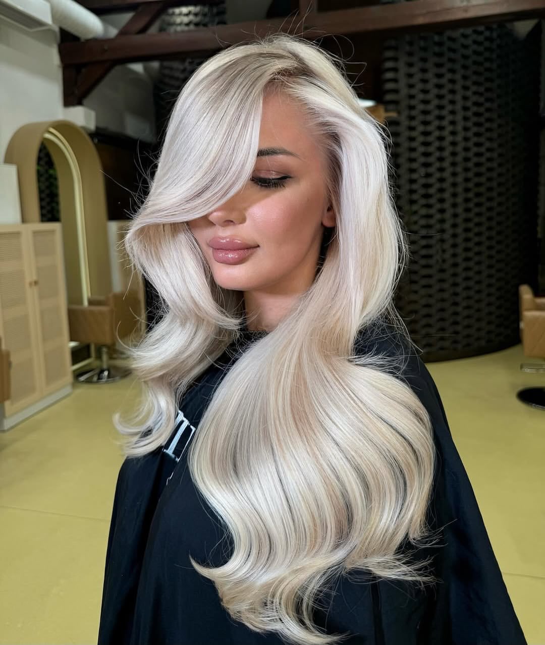 Platinum Blonde Waves With Face-Framing Layers