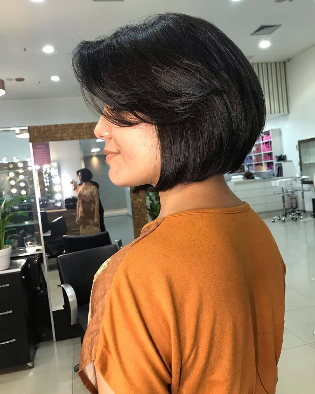 Polished Side Swept Bangs On Brunette Bob