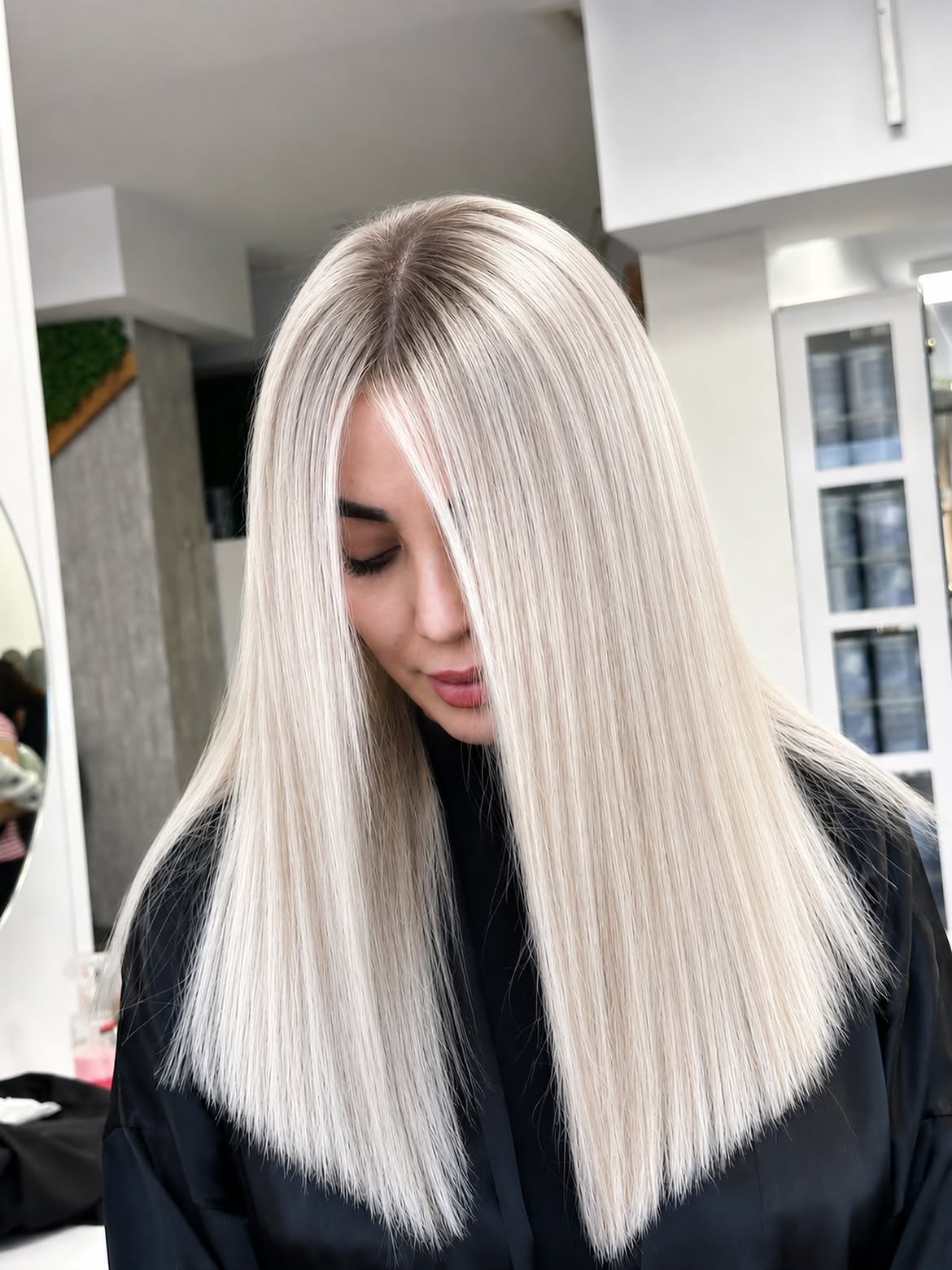 Sharp Platinum Blonde Blunt Cut With Dark Roots