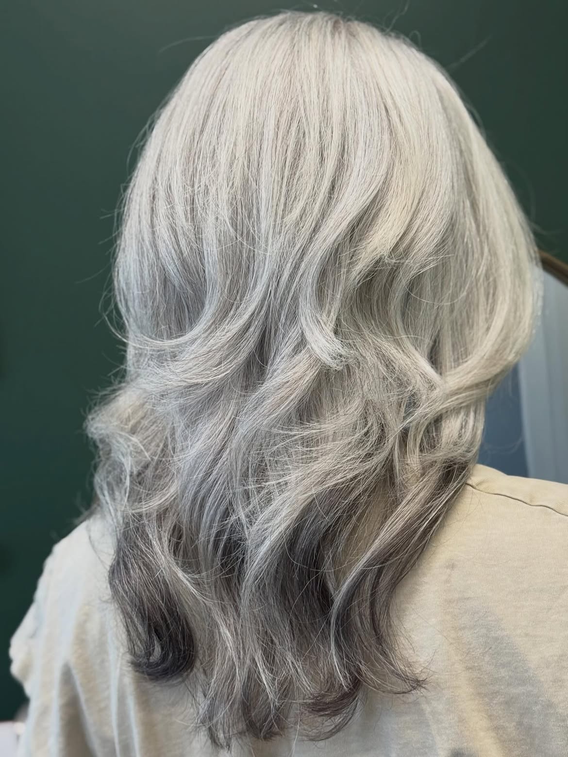 Silver Streaks With Soft Ash Blonde Waves
