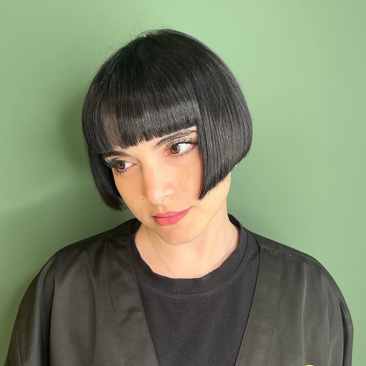 Sleek Black Chin-Length Bob With Blunt Bangs