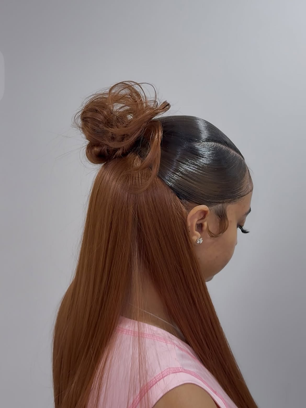 Sleek Half-Up Bun With Loose Curls