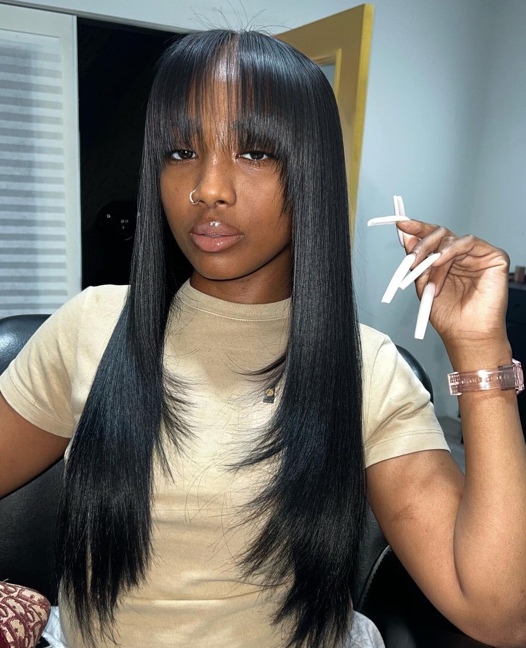 Sleek Jet Black Layers With Wispy Fringe