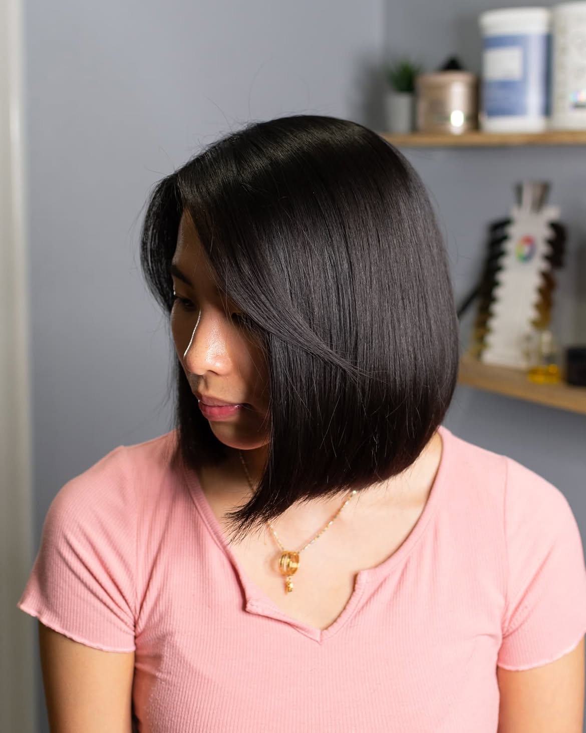 Sleek Side Swept Bangs On Glossy Jet Black Bob