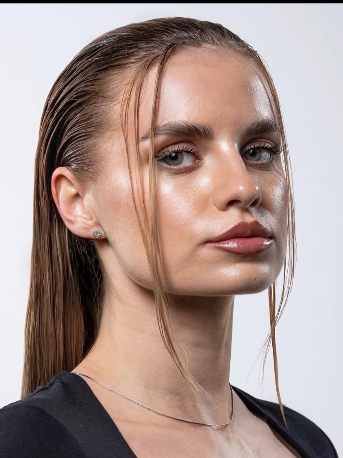 Sleek Wet Look With Face Framing Tendrils
