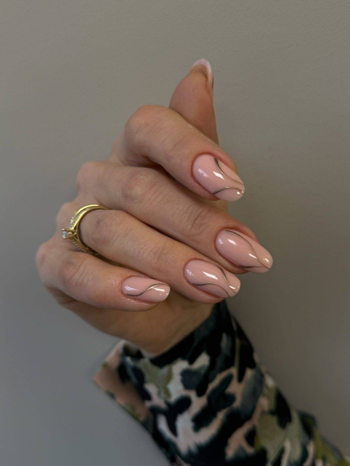 Soft Pink Oval Nails with Delicate Gold Lines