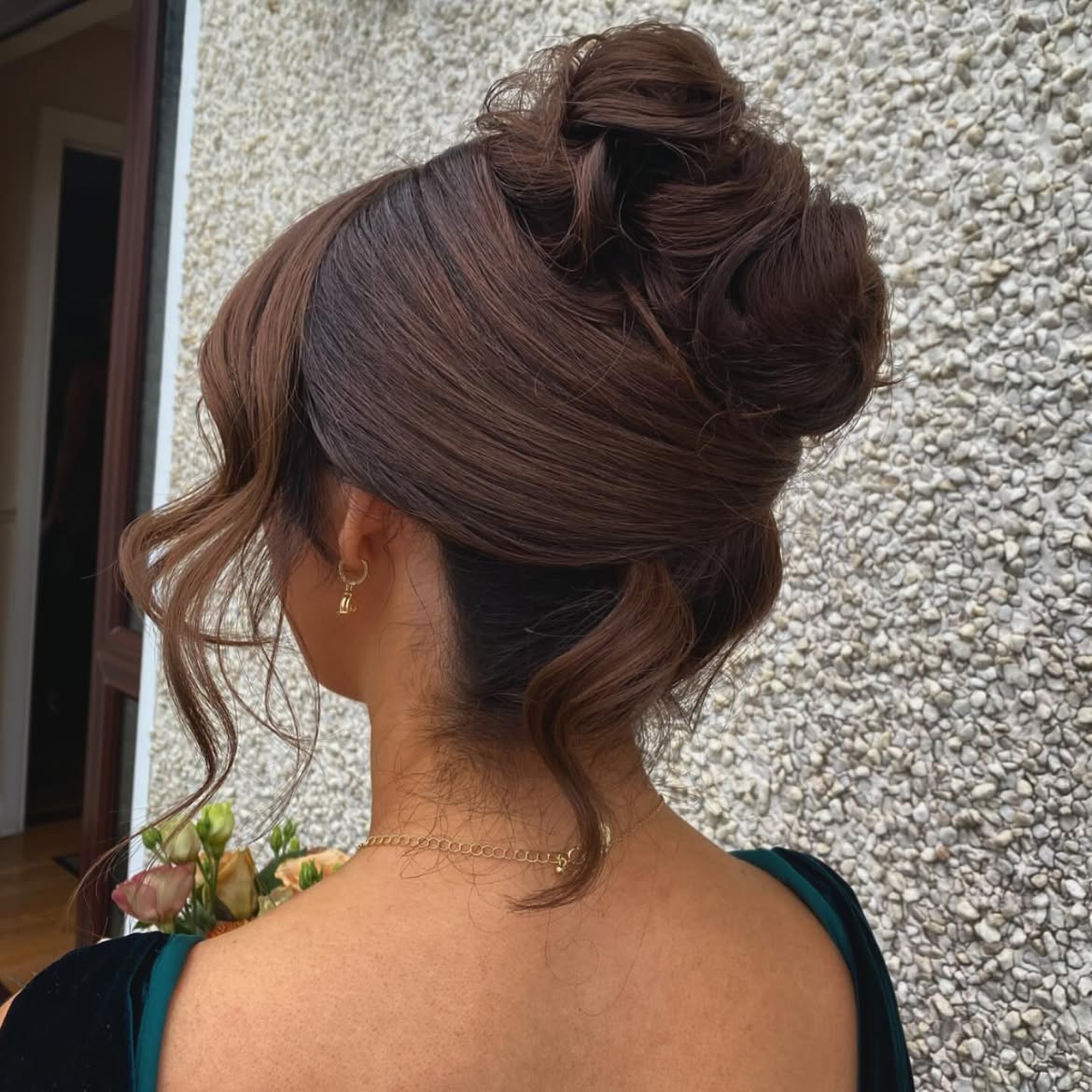 Sophisticated Tousled Updo With Face Framing Tendrils
