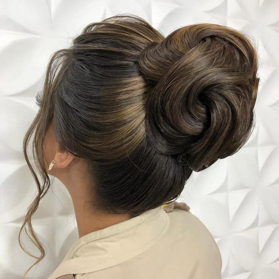 Sophisticated Voluminous High Bun With Caramel Highlights
