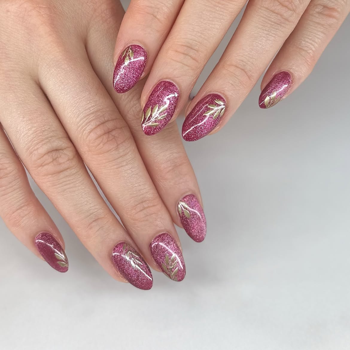 Sparkling Rose Gold Leaf Almond Nails
