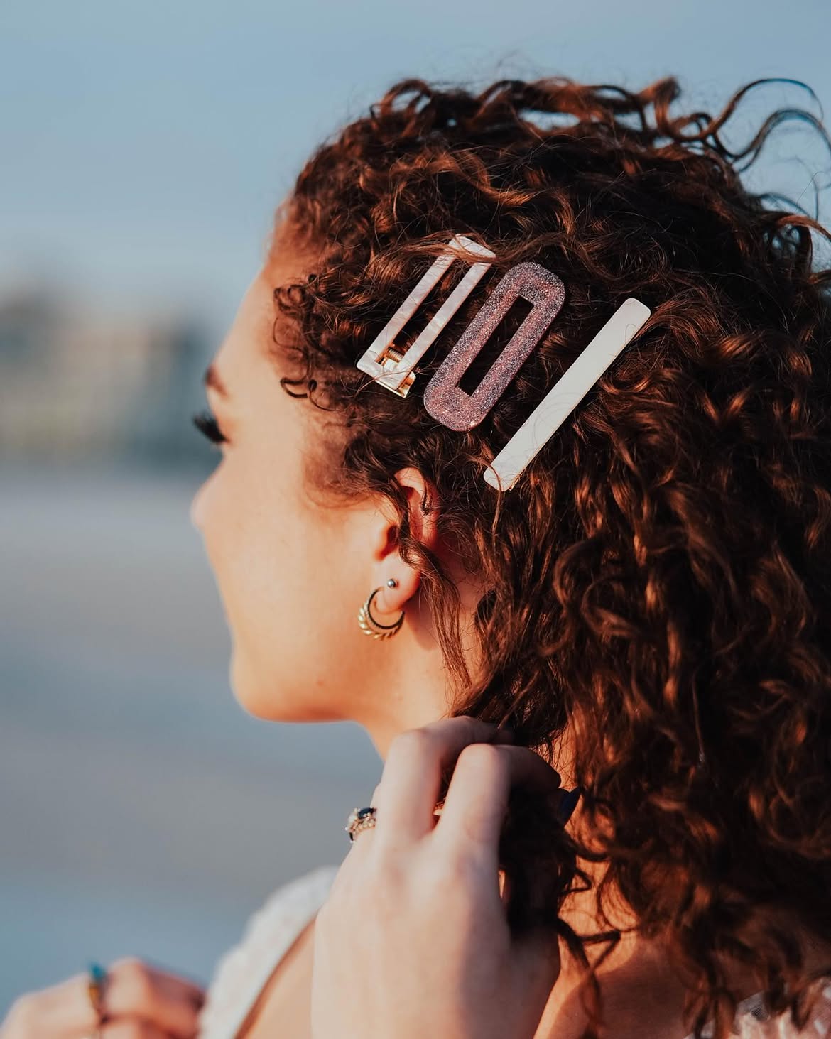 Sparkly Hair Clips With Curly Brown Hair